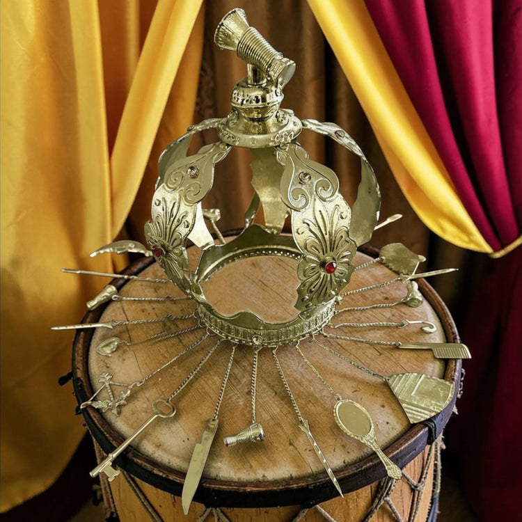 Decorative gold colored crown on a wooden drum