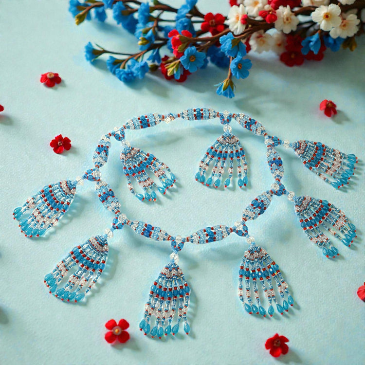 Beaded necklace on a light blue background with red and blue flowers.