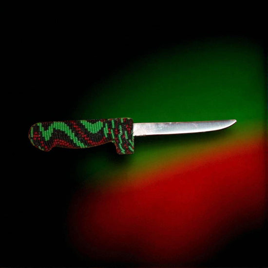 Knife with a colorful handle on a multicolored background